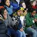 Audience members use their cells phones as they wait with 3,000 others for President Obama's speech at the Al Glick Fieldhouse on Friday morning.  Melanie Maxwell I AnnArbor.com